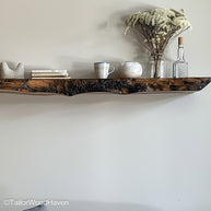 Floating bar shelves in rustic or dark wood tone for stylish bottle displays, perfect for home bar walls or dining area setups