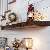 Rustic floating wood shelf made from thick hardwood with distressed edges and no visible brackets, perfect for warm and natural room themes