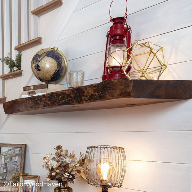 Rustic floating wood shelf made from thick hardwood with distressed edges and no visible brackets, perfect for warm and natural room themes