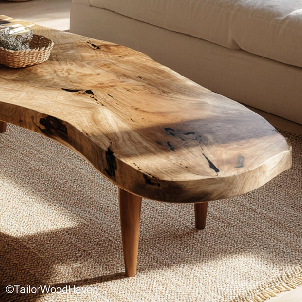 Rough edge wood coffee table built from thick cut timber with a rugged finish and organic contour, adding bold natural texture to your home