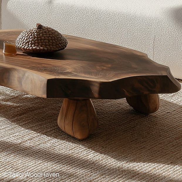 Natural cut wood coffee table created from a full timber slice with preserved texture and sealed surface, great for organic or log style rooms