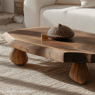 Natural cut wood coffee table created from a full timber slice with preserved texture and sealed surface, great for organic or log style rooms