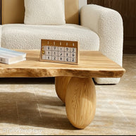 Pine slab coffee table crafted from thick pine wood with a sealed live edge and natural tone, perfect for cottage or farmhouse style spaces