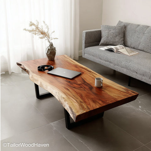 Narrow live edge coffee table crafted from long slender wood slabs with exposed grain and raw edge, ideal for small spaces or hallway setups
