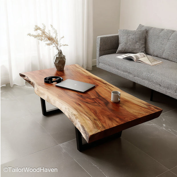 Narrow live edge coffee table crafted from long slender wood slabs with exposed grain and raw edge, ideal for small spaces or hallway setups