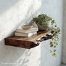 Nursery floating shelves in soft white finish with rounded corners, perfect for displaying baby books, toys, and keepsakes